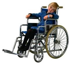 A young child seated in a wheelchair.